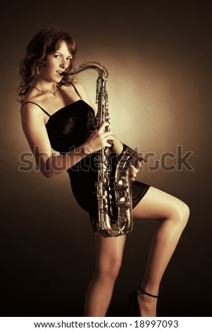 stock-photo-girl-with-saxophone-18997093.jpg