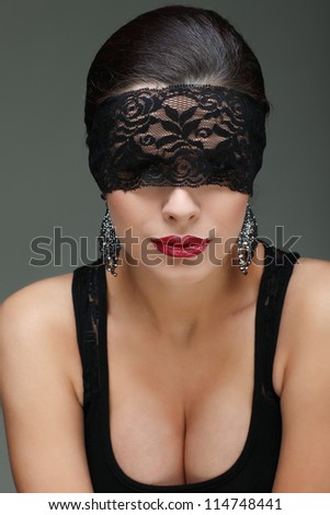 portrait elegant sexual  brunette woman is in a black lace mask