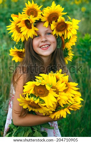 little glad girl with yellow on green a meadow, emotions, lifestyle