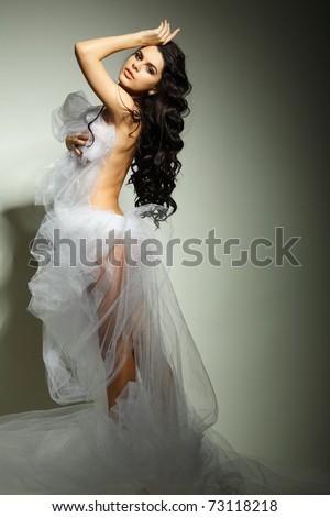 a beautiful young girl is in a bridal veil
