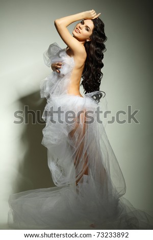 a beautiful young girl is in a bridal veil