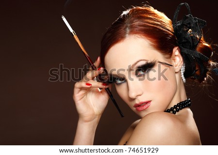 Portrait beautiful redheaded girl in retro style