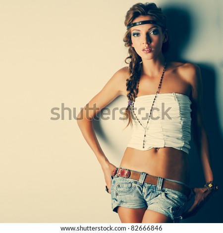 A photo of beautiful girl is in fashion style