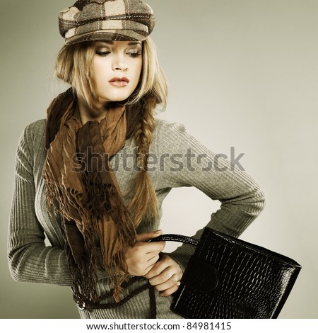 A photo of sexual  beautiful girl is in fashion style with a bag