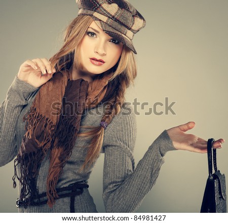 A photo of sexual  beautiful girl is in fashion style with a bag