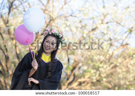 Fashion of graduate in thailand.Use fashion show concept action. ,graduation girl holding her bachelors.