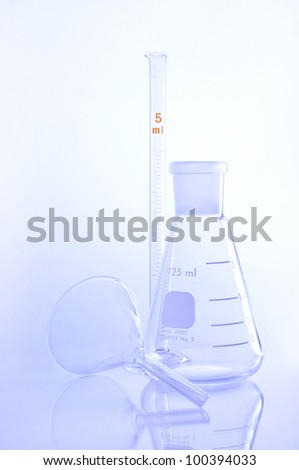 Elemeyer flask with glass funnel for chemical science use in laboratory.