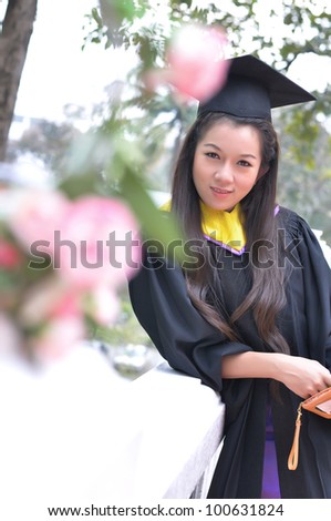 Fashion of graduate in thailand.Use fashion show concept action. ,graduation girl holding her bachelors.