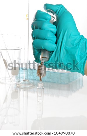 Fillter chemical solution in side vial for analytical science.