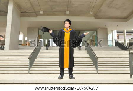 Fashion of graduate in thailand ,graduation boy holding his master\'s degree.
