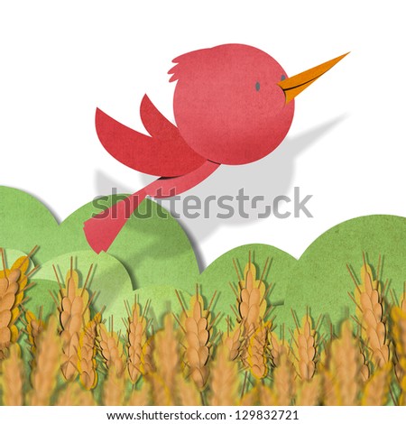 Red bird recycled paper craft on background