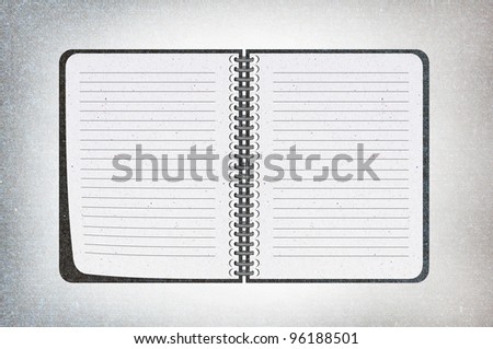 isolated black texture notebook on white,recycled paper craft stick on white background , open notebook on left side.