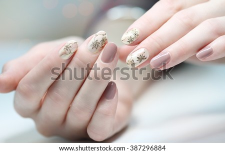 Nail design . Manicure nail paint . beautiful female hand with colorful nail art design manicure