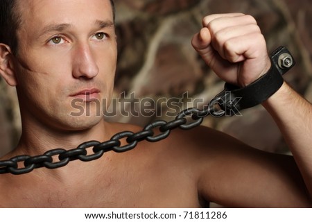 Man with a chains hands.