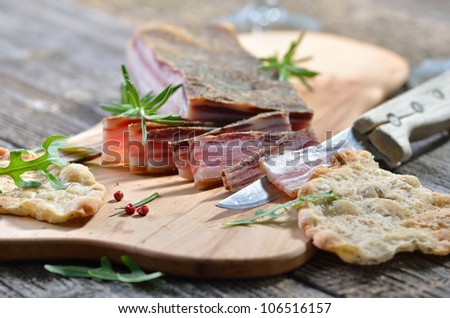 Snack with delicious South Tyrolean smoked bacon with crispy rye flat bread