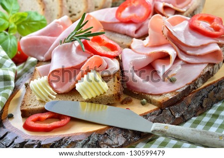 Snack with smoked ham and fresh farm-baked bread