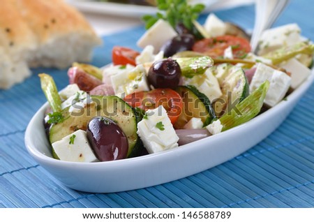 Greek fried vegetables with feta cheese, olives and pita bread