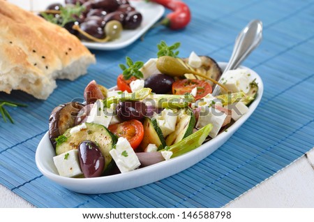 Greek fried vegetables with feta cheese, olives and pita bread