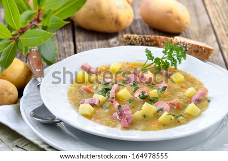 Freshly made potato soup with bacon strips and Vienna sausage wheels