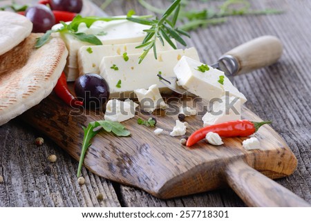 Greek snack with feta cheese, olives and pita bread