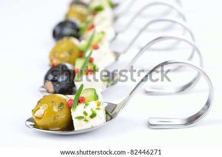 Greek appetizers on spoon