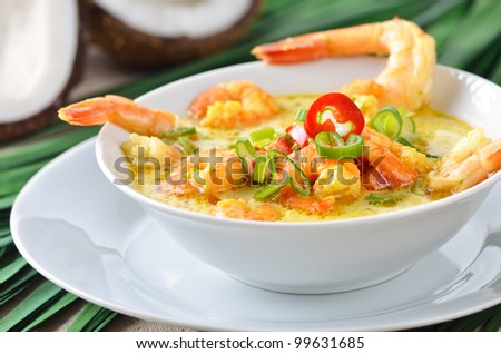 Hot coconut prawn soup with chili and curry