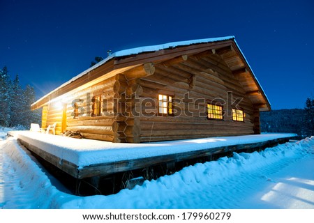 Log cabin in the snow, Canada