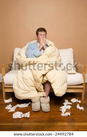 A sick man sneezing