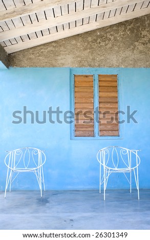 Couple of wire chairs on a porch in Vinales, Cuba