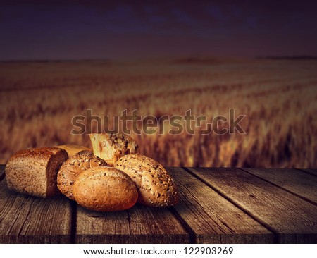 fresh bread on old wooden table of