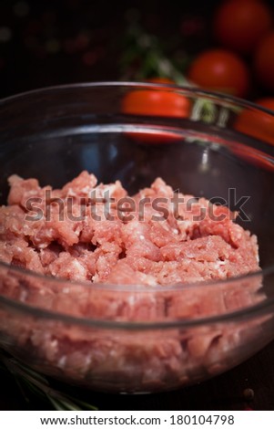 Chef making hamburgers in kitchen with ground beef