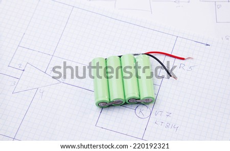 Batteries on the background on the electric scheme