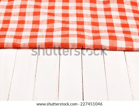 Tablecloth red and white checkered wavy on board