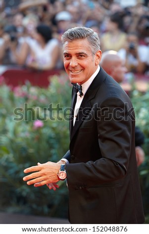 VENICE AUGUST 28 George Clooney greets fans as he arrives at the opening ceremony of the 70th Venice Film Festival on August 28 2013 in Venice VENICE AUGUST 28 George Clooney greets fans as he arrives at the opening ceremony of the 70th Venice Film Festival on August 28 2013 in Venice