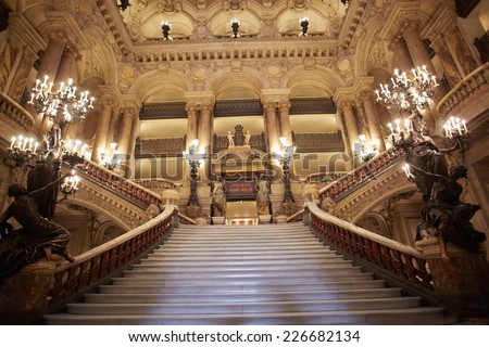 PARIS - JULY 6: Opera Garnier stairway, interior. Is the most famous Opera house in the world, known for the baroque opulence of the interiors, on July 6, 2014 in Paris.