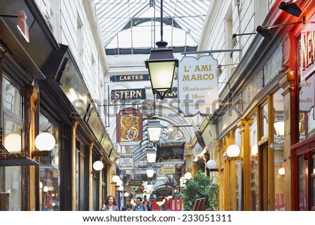 PARIS - JULY 10: Passage des Panoramas interior with shops and people. These typical passages were built during the first half of the XIXth century.on July 10, 2014 in Paris.