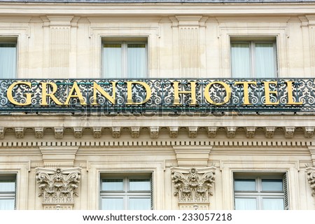 PARIS - JULY 6: Luxury Grand Hotel sign with golden letters on July 6th, 2014 in Paris, France.