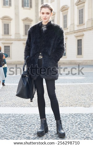 MILAN - FEBRUARY 25: Woman poses for photographers after Stella Jean show Milan Fashion Week Day 1, Fall/Winter 2015/2016 street style day 1, on February 25, 2015 in Milan.