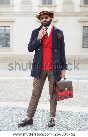MILAN - FEBRUARY 25: Man poses for photographers after Stella Jean show Milan Fashion Week Day 1, Fall/Winter 2015/2016 street style day 1, on February 25, 2015 in Milan.
