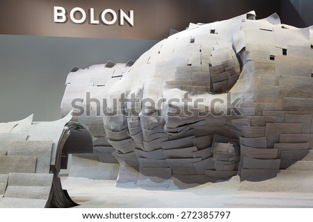 MILAN, ITALY - APRIL 14: Milan Design Week, Bolon stand with face sculpture at Salone del Mobile opening on April 14, 2015 in Milan.