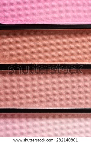 Brown and pink eye shadow palette texture background
