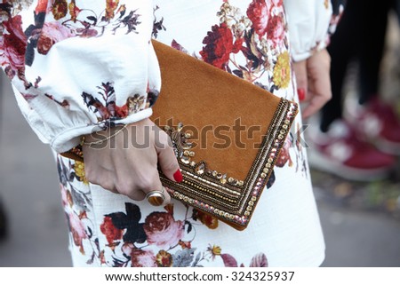 PARIS - SEPTEMBER 30: Woman with decorated bag poses for photographers before Yang Li show, Paris Fashion Week Day 2, Spring / Summer 2016 street style on September 30, 2015 in Paris.