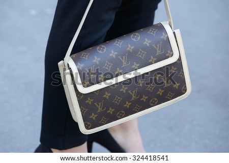 PARIS - SEPTEMBER 30: Louis Vuitton bag before Rochas show, Paris Fashion Week Day 2, Spring / Summer 2016 street style on September 30, 2015 in Paris.