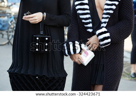 PARIS - SEPTEMBER 30: Women poses for photographers before Rochas show, Paris Fashion Week Day 2, Spring / Summer 2016 street style on September 30, 2015 in Paris.