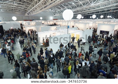 TURIN, ITALY - NOVEMBER 6: Artissima, contemporary art fair opening with people, galleries and art collectors on November 6, 2015 in Turin, Italy. Crowd seen from above attending the art fair opening.