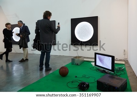 TURIN - NOVEMBER 6: Artissma, contemporary art fair opening with people, galleries and art collectors on November 6, 2015 in Turin, Italy. Man photographs art installation.