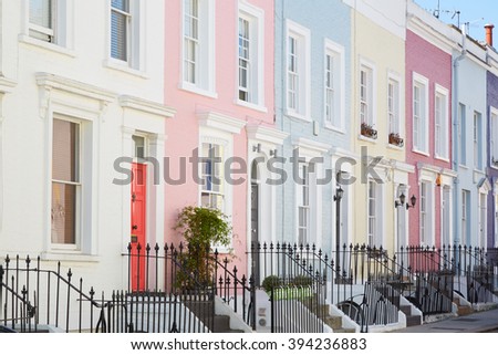 Colorful English houses facades, pastel pale colors in London