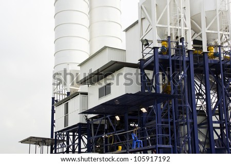 Raised cement construction Factory with Silos attached.