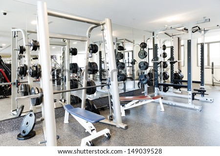 Weight lifting equipments in a club gym Weight lifting equipments in a club gym