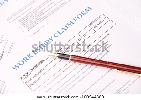 Blank work insurance claim form and fountain pen